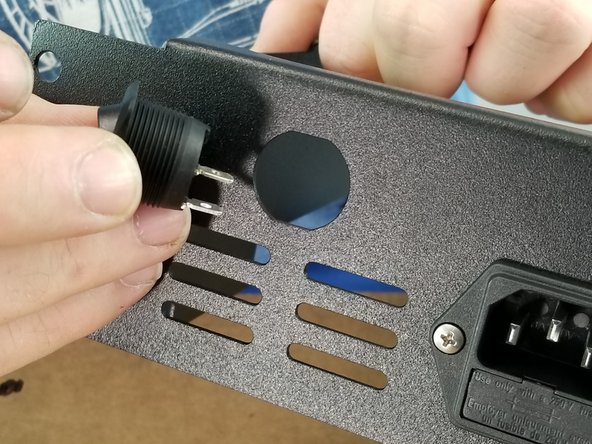 Install the rocker switch into the hole of the power supply bracket as shown in Pic 2 with the legs of the rocker switch closest to the vent holes.