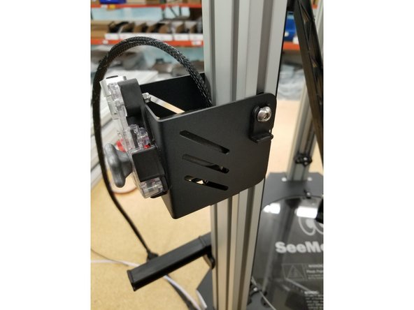 Reinstall the extruder assembly over the hole as it was before.