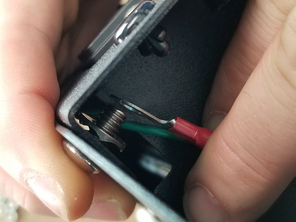 Place the large ring terminal with green wire over the screw and on top of the spike washer as shown in Pic 2.