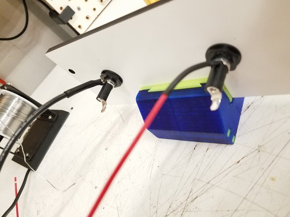 Solder the 18awg red wire and 12awg black wire from the kit to the top prong on the fuse holders and heat shrink the solder joint.