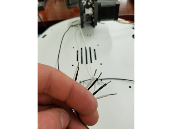 In this step you will strip the ends of the existing end stop wires so that they can be soldered to the new KK crimped end stop wires included in your pack.