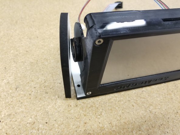 Align the printed enclosure to where it will be sitting in the side panels, with the SD card slot facing away from the main mounting plate.