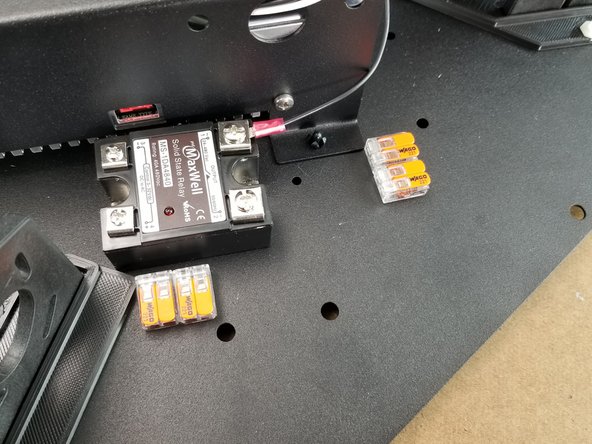 Attach two of the connectors next to the relay and two of them behind the relay as shown in Pic 3.  Just press them in place and the adhesive will secure them in place.