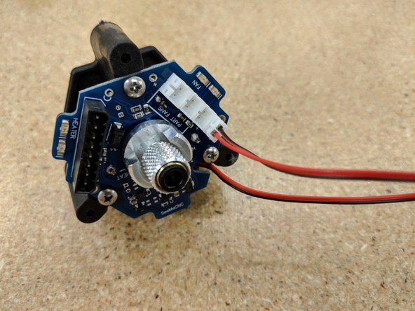 Connect the hot end fan to the JST connector on the far right of the PCB as shown.