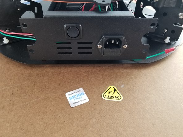 Attach the SE300 probe sticker and the 110VAC stickers to the power supply bracket as shown in Pic 2.
