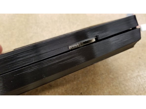 Make sure the opening for the SD card lines up with the SD card slot at the bottom of the screen.