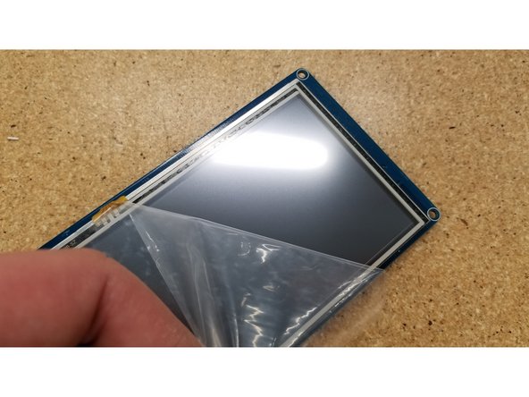 Peel the film off the touch screen.