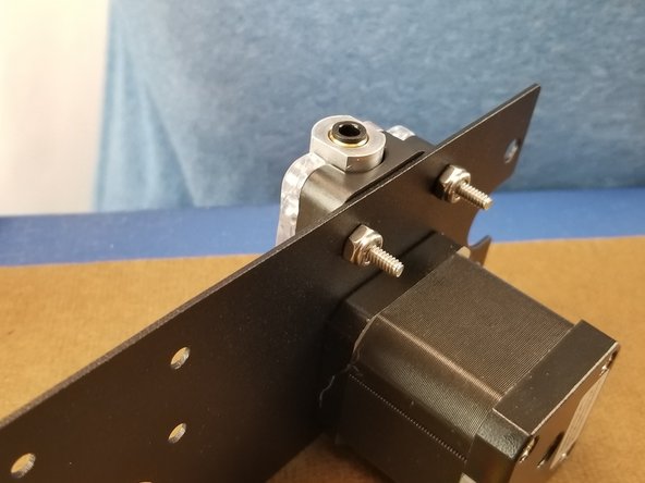 Use the nylon lock nuts to secure the screws and tighten the ezr struder to the extruder plate as seen in Pic 3.