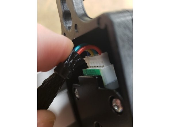 Fold the 6-pos motor plug in a U-shape to be able to plug into the motor, two bumps facing out/metal facing in.