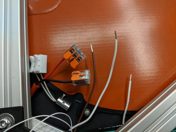 Locate the two white and one brown wires that at exiting the Z tower in the bottom assembly.