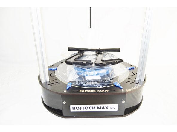 Replace the glass build plate back on the printer.