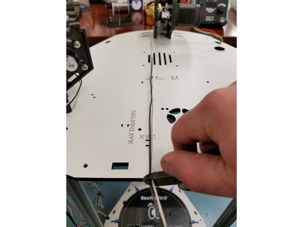 Next step is preparing your end stop wires for the Duet3D-WiFi board. Start by trimming the wires down to length. Pull the wires to the opposite edge of the Laser Cut Plate and snip the off excess.