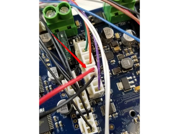 Plug the fan in at the location indicated in the photo.