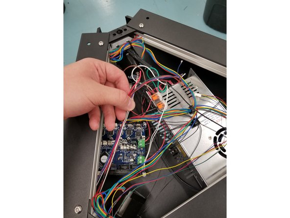 Pull the wires through the tower until the mesh loom enters the hole in the tower and there is enough wire to reach all the connection points in the top assembly when wrapped around the tower.