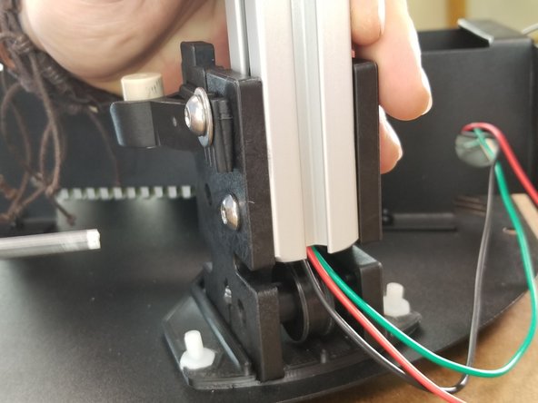 You will lower the extrusion as far as it will go in the brackets.  The bottom of the extrusion will line up with the notches located on the brackets as shown in Pic 3.