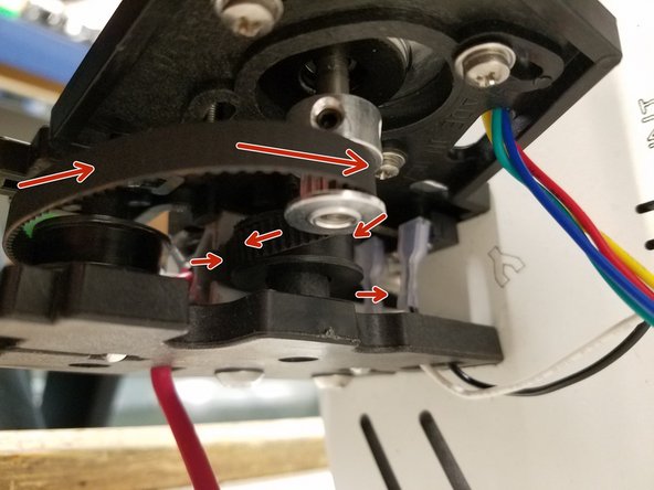 Thread the belt back up the tower and over the top idler bearing and back into the other side of the tower. Now pull the belt up over the timing pulley and it should look like the first picture.