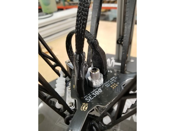 Slide the boots in to place, routing the whip extension through the opening in the back of the 10 pin boot as shown.