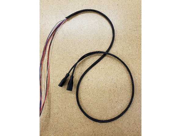 Pass all the cables through the mesh loom.