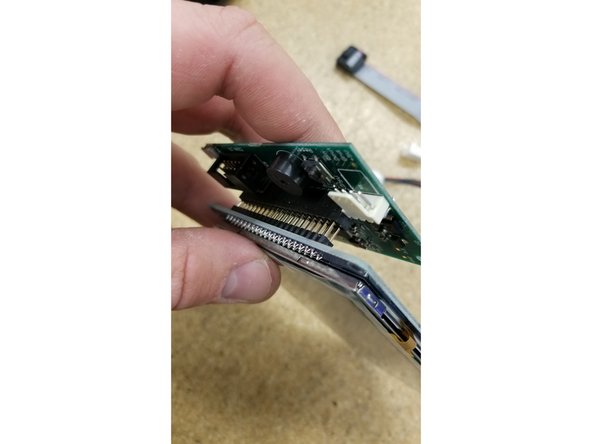 Install the  PanelDue control board  on the touch screen as shown. Be sure the pins all align and plug in fully.