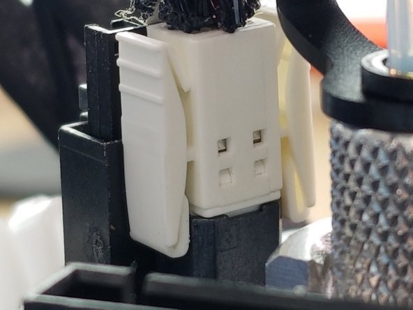 Slide the boot over the connectors to cover and protect the clips as shown in Pic 3.  The boot will slide fully down to the hotend board.