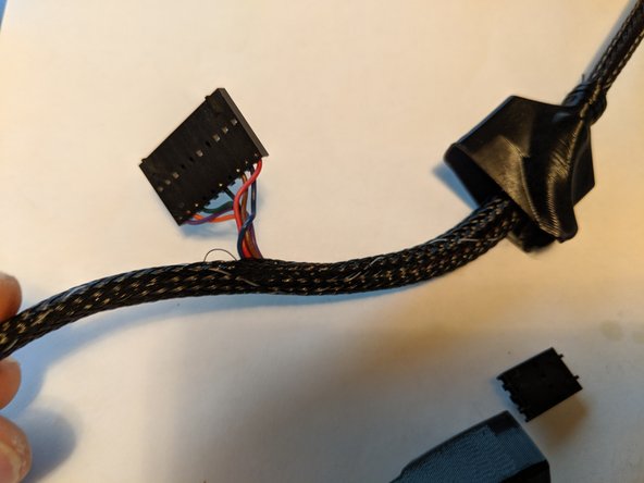 We will now be working near the 10 pin plug.  Slde the boot up and out of the way to work in this area as shown in Pic 1.