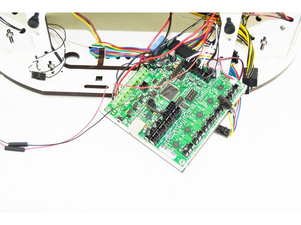 Slide a 15mm long heat-shrink tubing over the black wire that is in the 4 pin latching housing. (as shown in the picture)