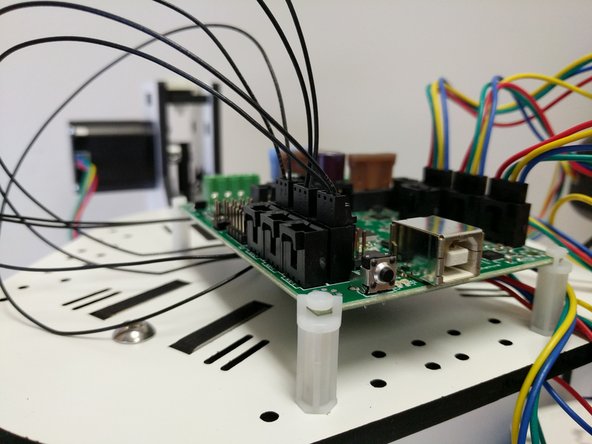 Insert the wires into the 3 pin connector housing into pin 1 (with arrow) and pin 2 until you hear/feel a click. Do this for the X Y &amp; Z tower endstops.