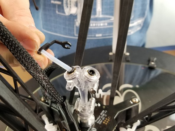 Install the PTFE tubes into the Y Adapter and clip the lanyards in place, just as you did on the EZR Struder