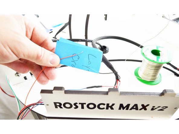 Locate the wire you labeled as Layer Fan. This will go with the Orange wire from the new hot end whip.