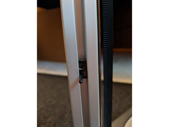 Approximately 6 inches from the bottom of the extruder mount, take and insert the threaded t-nut adapter into the extrusion as shown in Figure 1.