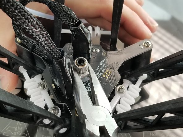 Carefully loosen the locking nut from the knurled PTC assembly