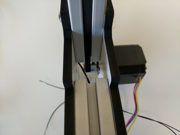 Begin routing the belt up the TSLOT.