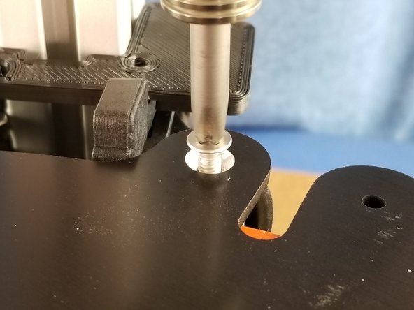 Screw the M4 x10mm flat head screws through the bed into the PEEK insulators at each of the 3 mounting tabs on the heated bed as shown in Pic 2.