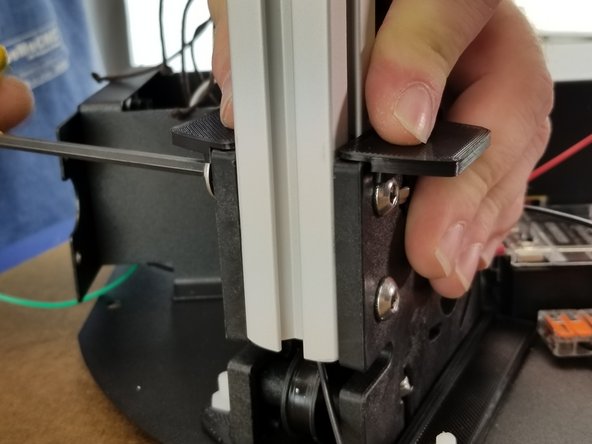 Install the last remaining small shim on the Z tower.