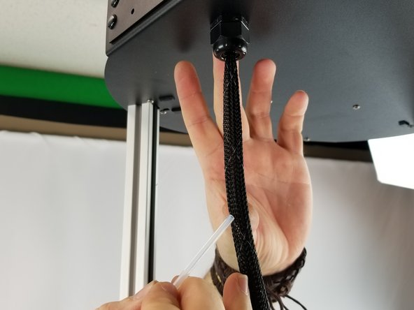 Approx. 7 inches from the top of the machine, you will be putting the PTFE tube inside the covering for the hotend whip.