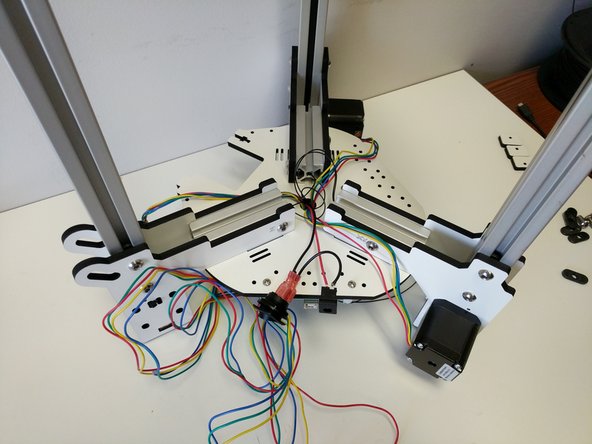 Before we can install the base assembly top plate, we need to tame the wires in the base.