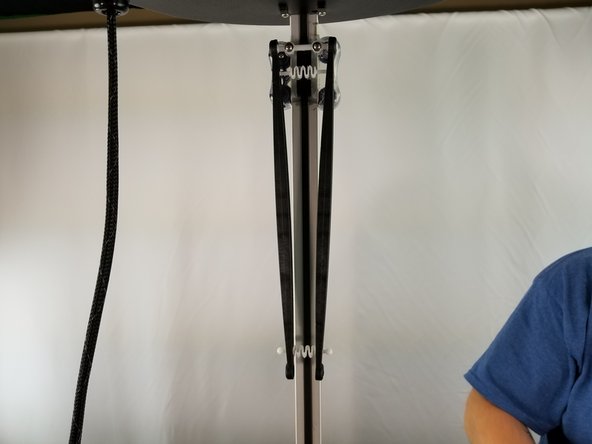 The springs will go in the large hole, and slide towards the end of the arms where it will sit in place so it cannot fall out. See pic 1.