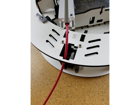 Next you will feed the 12awg wire down through the melamine plate.