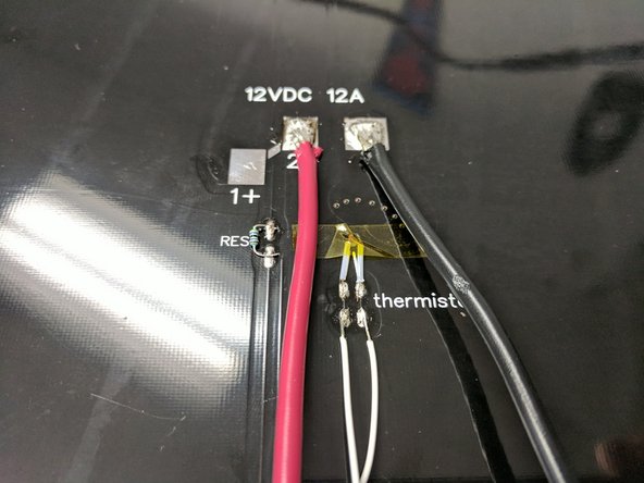 Solder the thermistor leads to the pads where indicated. There is not polarity so either wire on either pad will work. Since these pads are smaller, you want to be sure not to heat them too hot for too long or the pad can detach from the board.