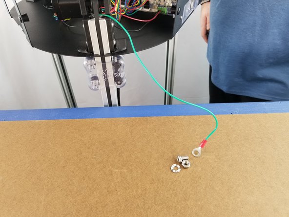 Next we will use one of the button head screws, one of the nylon lock nuts, and the spike washer from the upper hardware pack.