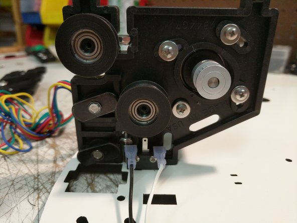 Begin with the Z tower location and install a pair of end stop wires on the end stop as shown.