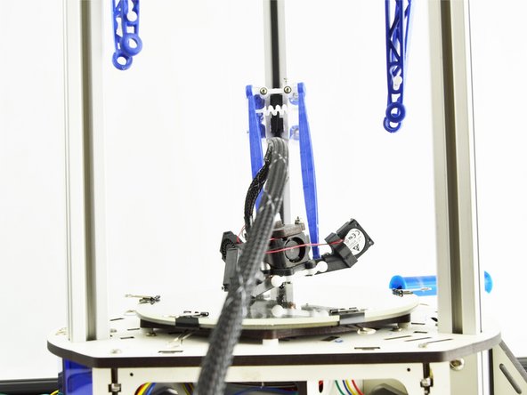 Remove the ball cup arms from the effector platform. To do so, gently pull the ball cup arm off of each ball joint.