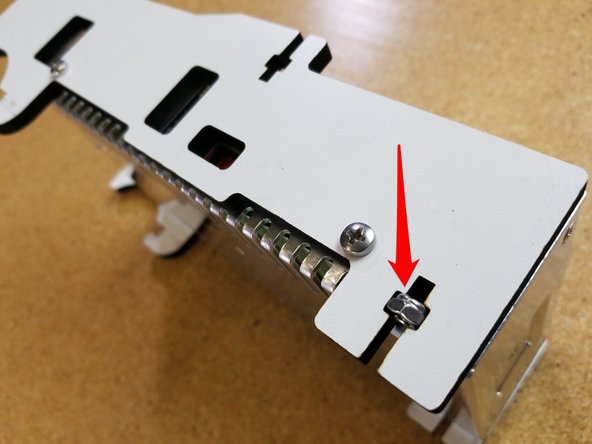 Install the PSU Blocker sides using (2) M4 x 12 per side. To ensure proper orientation, make sure that the voltage selector is visible through the &quot;window&quot; laser cut in the side of the blocker panel.