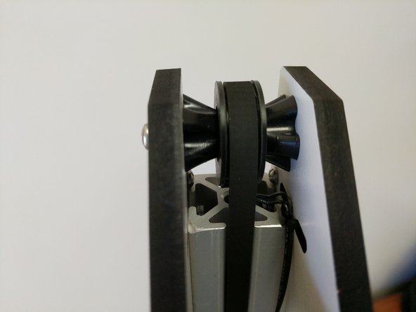 Route the belt up the TSLOT and over the idler bearing.