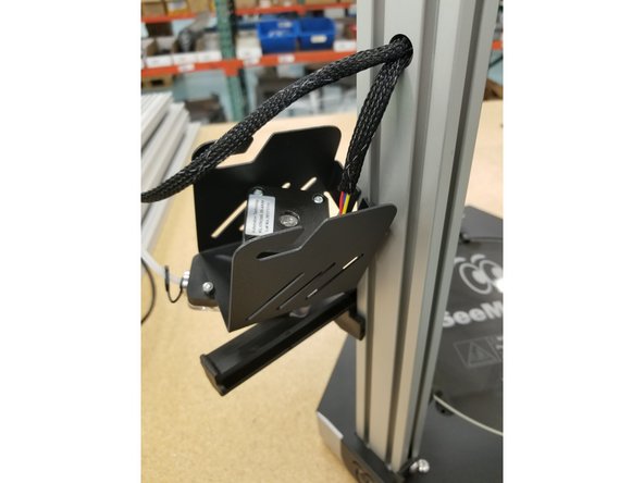 Remove the extruder assembly and rest on the spool holder to keep it out of the way for future steps.