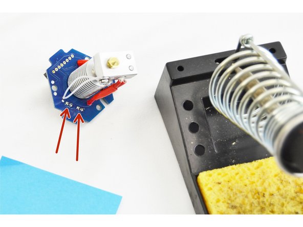 Insert and orient the parts as shown in the picture.  The solid face of the plug should be facing towards the center of the hot end.