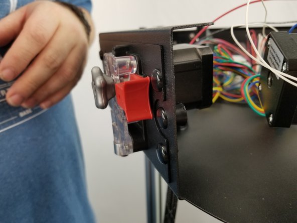 Around the top frame using the center holes on each side, you line up the panel stops with the holes on each side in the center and insert the nylon push rivet through the upper frame into the panel stop and push the head of the rivet to lock the panel stop in place.