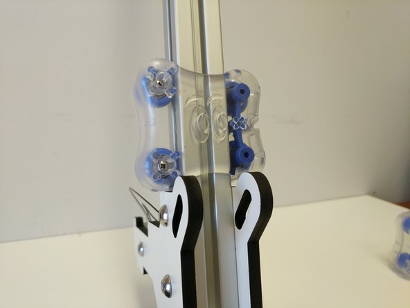 Slide the carriage that you previously assembled onto the TSLOT from the top. The Blinky Eye logo should be in the orientation shown in the image.