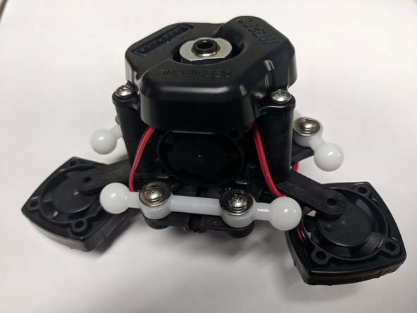 REV6 Boards will have to route each fan lead up to the board separately as shown in the third image. You may have to re-route the wires that you did in step 49 to find the best route to the fan connectors.