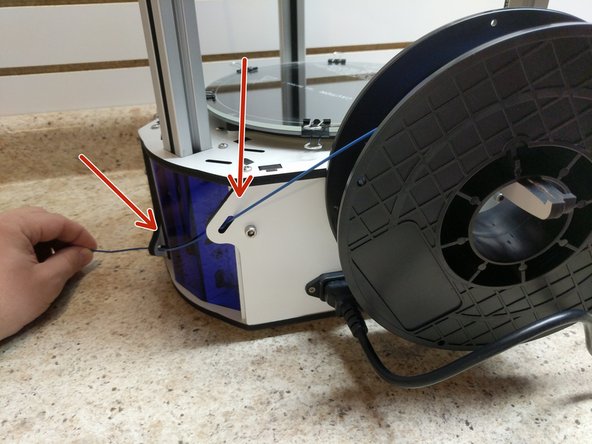 Remove the filament from the packaging.